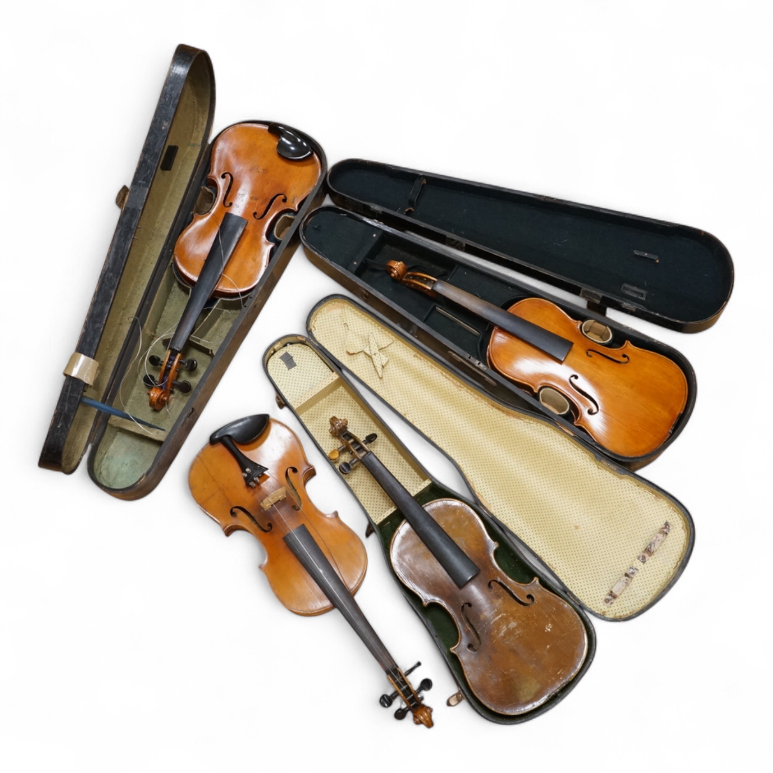 Four violins; a German Dresden violin, together with further two German violins, and a Saxony violin, three in cases or the remains of cases.